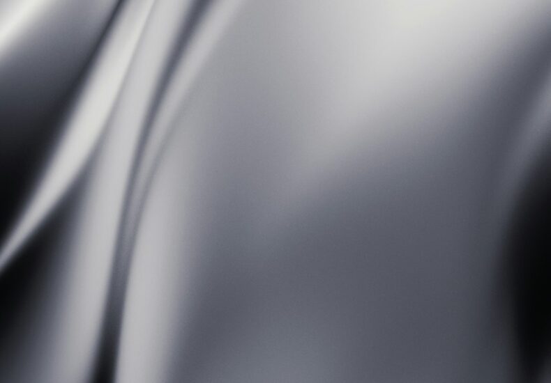 a black and white photo of a wavy background