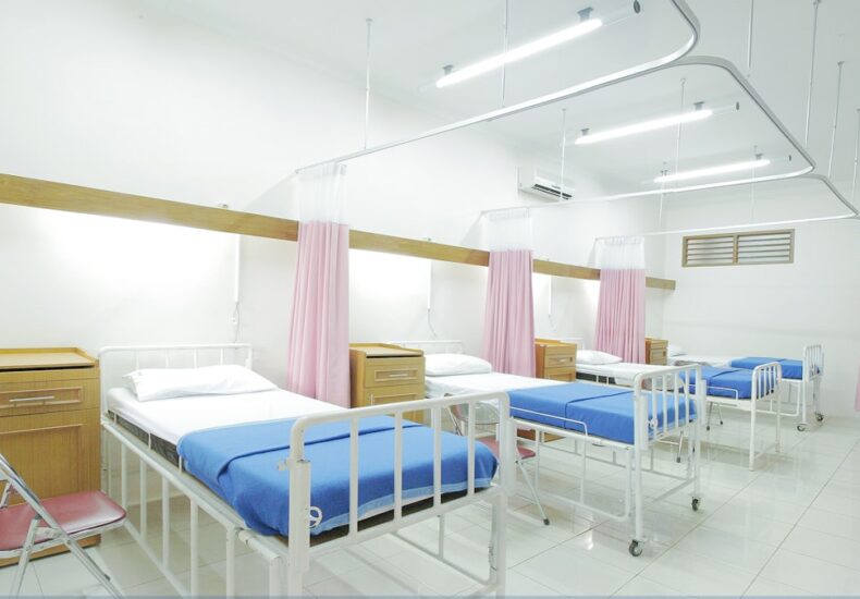 empty hospital bed inside room