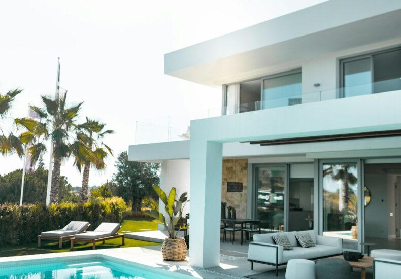 white concrete building with swimming pool