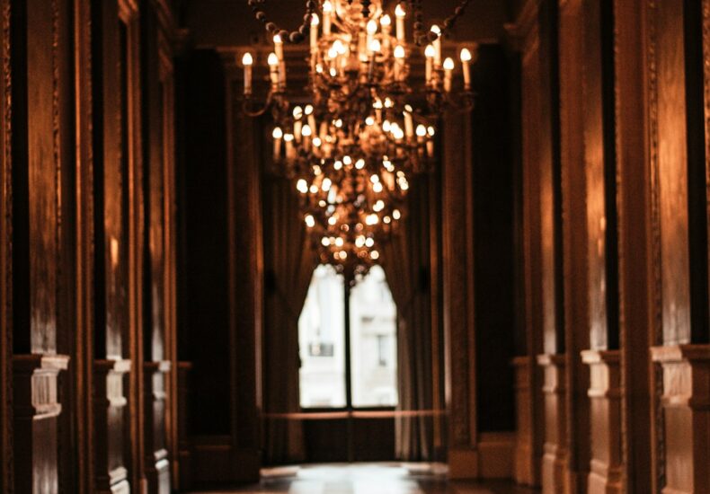 lightened chandelier inside the hall