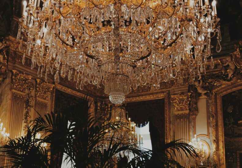 white and gold-colored chandelier