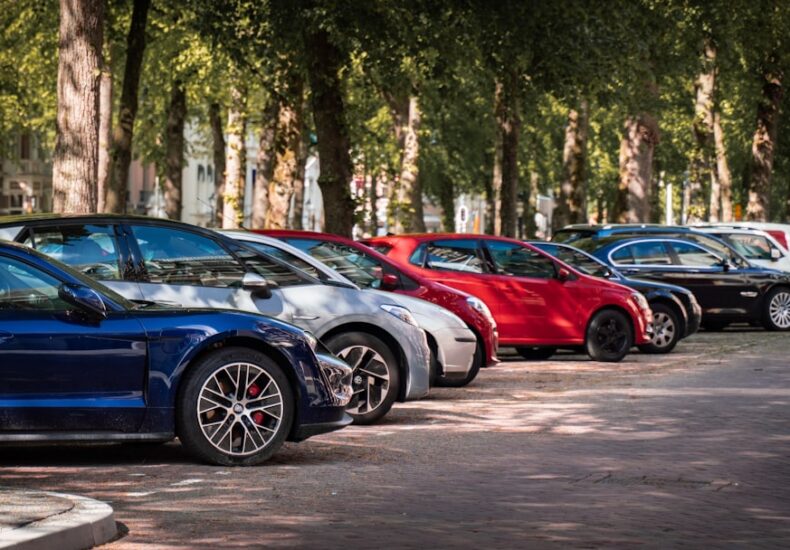 blue and red sports car on road during daytime