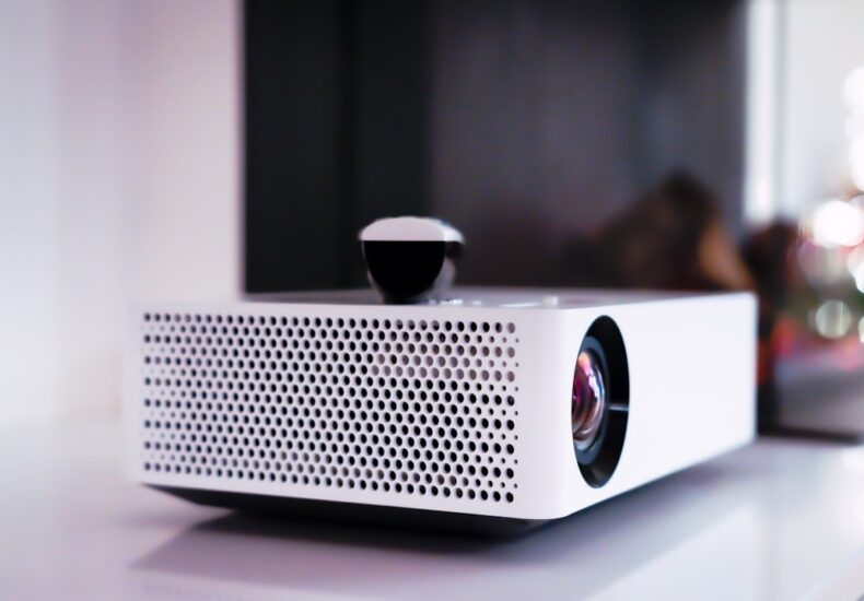 black and white projector on white table