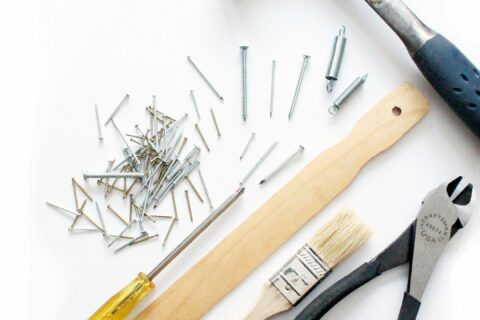 yellow and black handle hammer and screw driver