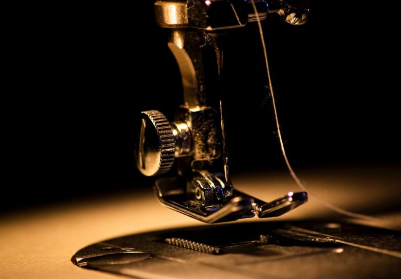 a close up of a sewing machine on a table