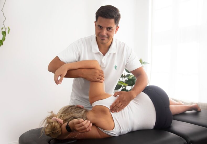 a woman getting a back massage from a man