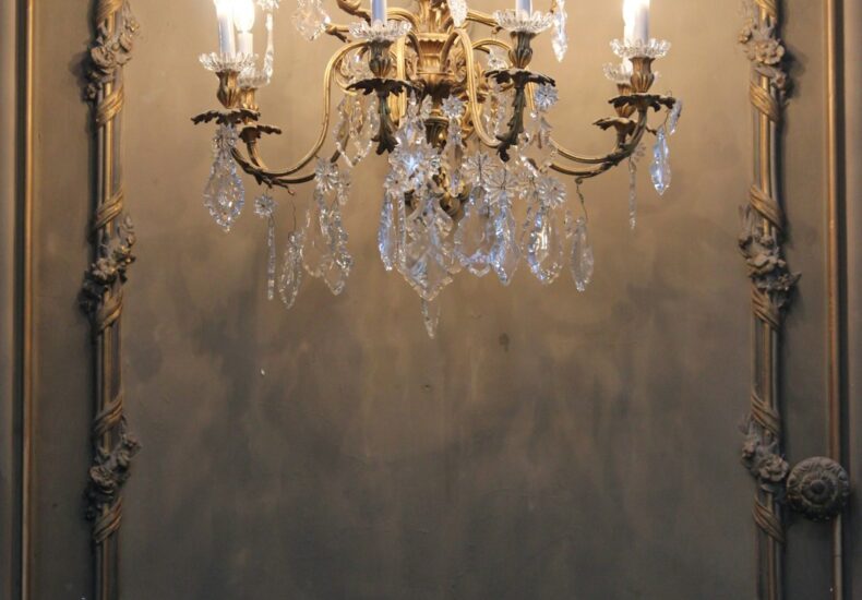 gold and white uplight chandelier