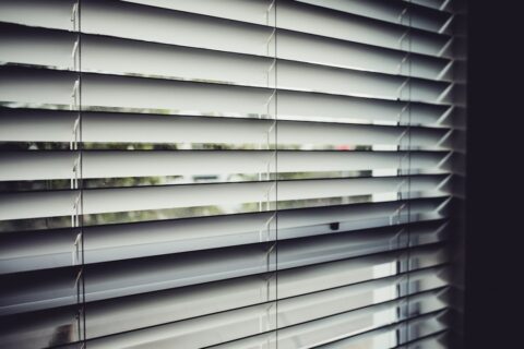 close view of white window blinds