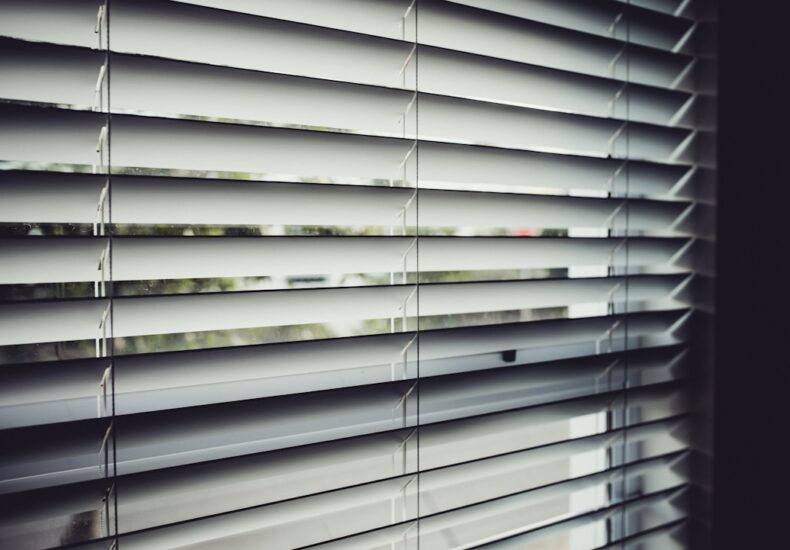 close view of white window blinds