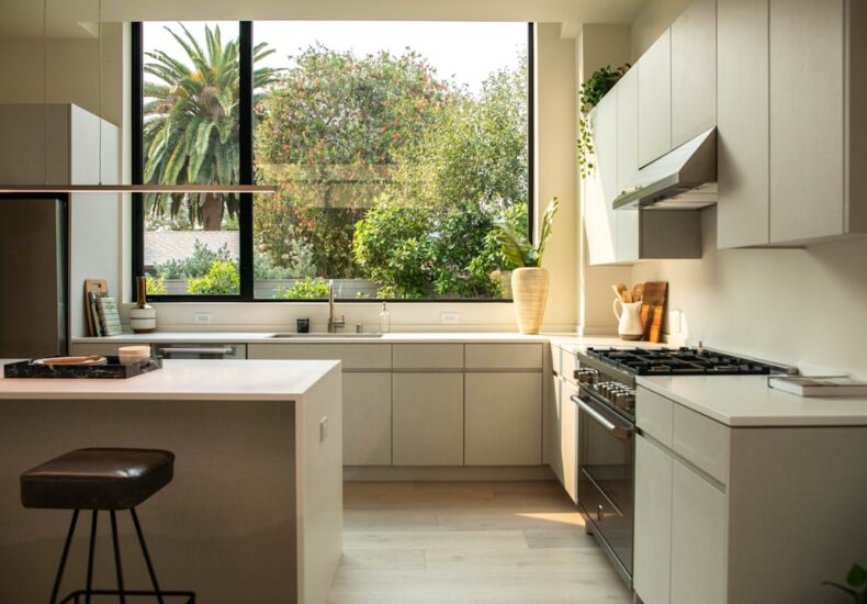 modern kitchen with island and large window