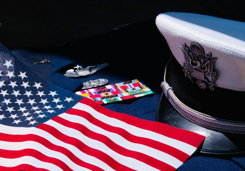 an american flag laying on top of a uniform
