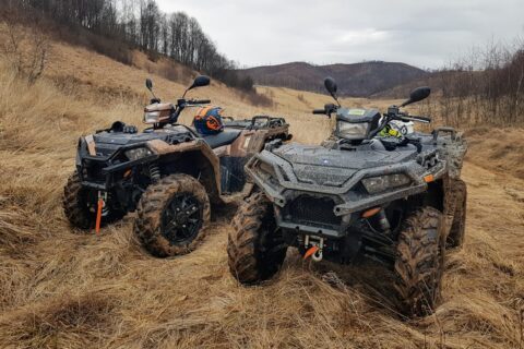 black and gray atv on brown field during daytime
