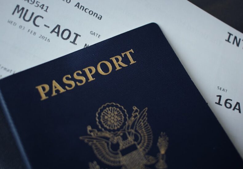 passport booklet on top of white paper