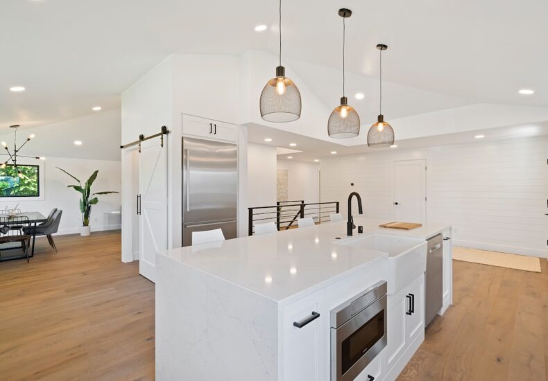 turned on pendant lamps above kitchen island