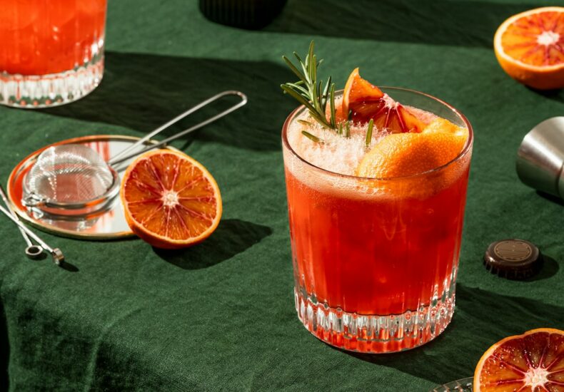 a glass of orange juice on a table