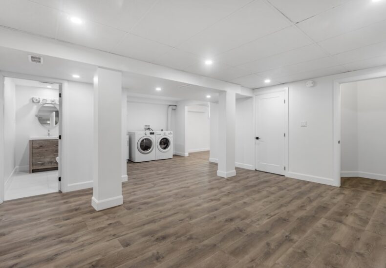 an empty room with a washer and dryer