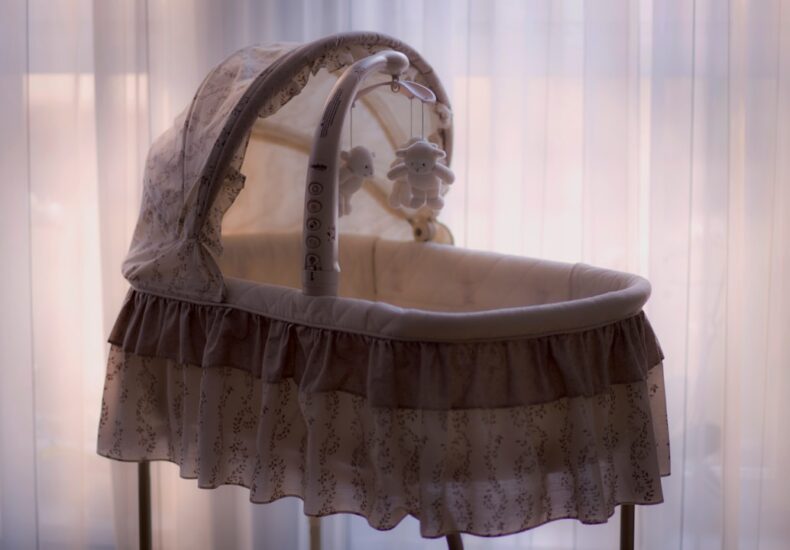 baby's white and black bassinet
