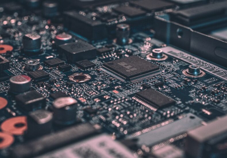 macro photography of black circuit board