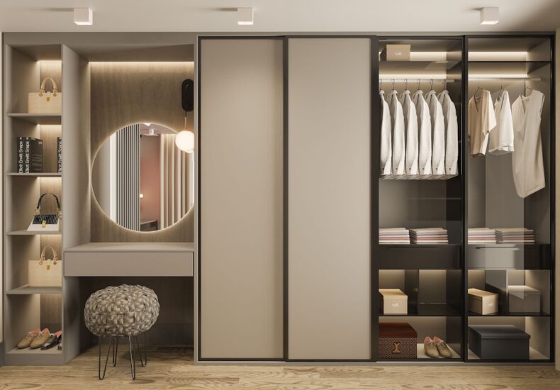 a walk in closet with a mirror and a stool
