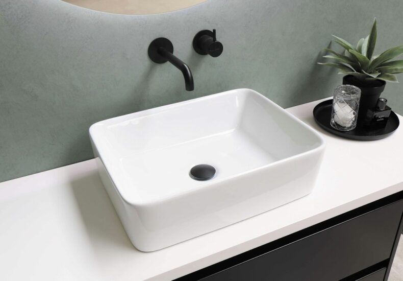 white ceramic sink with stainless steel faucet