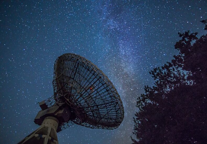 white satellite dish under blue sky during night time
