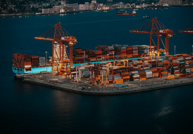 Container ship and cranes at a busy shipping port