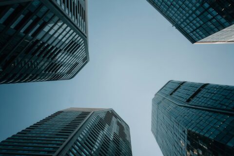 Modern skyscrapers reaching towards a clear blue sky